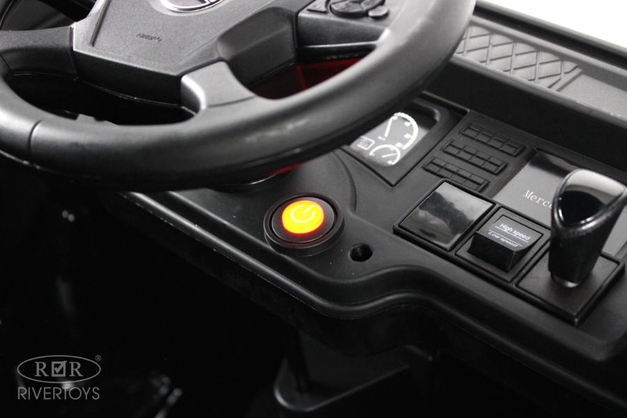 Детский электромобиль RiverToys Mercedes-Benz Actros 4WD (HL358) черный глянец