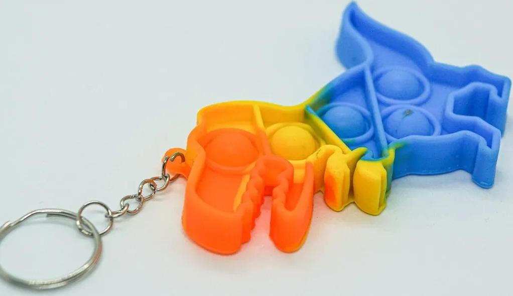 Брелок-игрушка POP IT Динозавр (6х9см) антистресс (тактильная, сенсорная)